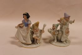 A PAIR OF LENOX DISNEY SNOW WHITE AND THE SEVEN DWARVES CANDLESTICKS