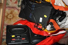 A SEGA MEGA DRIVE 2 CONSOLE WITH MEGA CD 2 ATTACHMENT TOGETHER WITH A PS2 CONSOLE AND CONTROLLERS