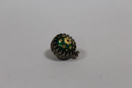 A VINTAGE FLORALLY ENAMELLED SPHERICAL PENDANT / CHARM