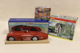 A SCHYLLING COLLECTORS SERIES SUNBEAM 1000 LAND SPEED RECORD CAR TOGETHER WITH A RANDOM RACER TIN