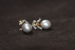 A PAIR OF LARGE GREY PEARL AND DIAMOND BOW TOP EARRINGS, boxed