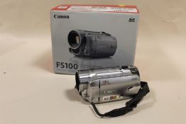A BOXED CANON FS100 CAMCORDER