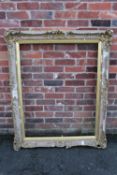 A 19TH CENTURY GOLD SWEPT FRAME WITH INTEGRAL SLIP A/F, frame W 10 cm, rebate approx 113 x 87 cm