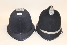 TWO VINTAGE POLICE HELMETS