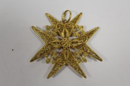 A YELLOW METAL FILIGREE CROSS PENDANT (STAMPED TO TOP LOOP OF PENDANT)