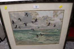 A FRAMED AND GLAZED COLOURED ETCHING DEPICTING SEAGULLS IN FLIGHT SIGNED HANS FIGURA