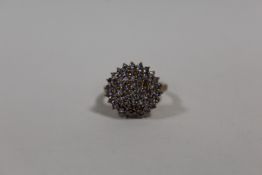 A 9K GOLD DRESS RING SET WITH LILAC COLOURED STONES (ONE STONE MISSING) SIZE - Q APPROX WEIGHT - 4.