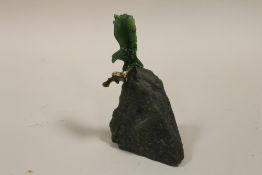 A CARVED JADE MODEL OF AN EAGLE WITH PREY