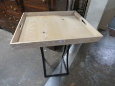 A MODERN LIMED STYLE OCCASIONAL TABLE WITH BLACK METAL BASE