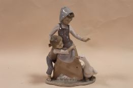 A LLADRO FIGURE GROUP OF A MOTHER AND CHILD WITH A GOOSE