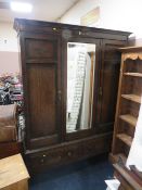 AN EARLY 20TH CENTURY OAK MIRRORED WARDROBE WITH DRAWER TO THE BASE H 203 cm, W 158 cm
