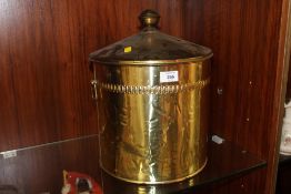 A BRASS EFFECT LIDDED COAL BUCKET