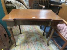AN ANTIQUE MAHOGANY FOLD-OUT TEA-TABLE