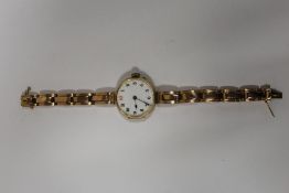 A VINTAGE HALLMARKED 9 CARAT GOLD CASED WRISTWATCH WITH ENAMEL DIAL ON 9CT GOLD EXPANDABLE BRACELET