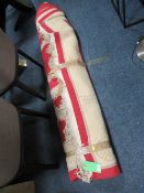 A LARGE CHINESE WOOLLEN RED AND CREAM RUG ?? x ?? cm