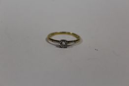 AN 18CT GOLD DIAMOND SOLITAIRE RING