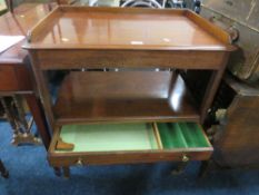 A MAHOGANY SERVING TROLLEY WITH FRIEZE DRAWER