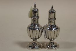 A PAIR OF HALLMARKED SILVER PEPPERETTES APPROX WEIGHT - 55G