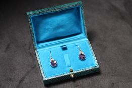 A PAIR OF FLOWER DESIGN DROP EARRINGS, set with amethysts and diamonds, boxed