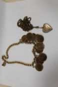 A YELLOW METAL CHAIN WITH MOUNTED HALF PENNY COINS, TOGETHER WITH A LOCKET PENDANT ON LONG MUFF