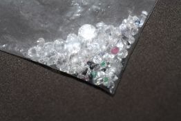 A BAG OF LOOSE MIXED STONES, including cubic zirconia, ruby, sapphire and emerald 73.55ct