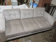 A MODERN SILK EFFECT BUTTONED THREE SEAT SOFA