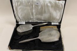 A HALLMARKED SILVER PEPPERETTE, TOGETHER WITH A SILVER COIN (2)