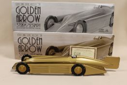 A BOXED SCHYLLING GOLDEN ARROW WIND UP MOTOR MODEL