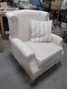 A MODERN LIGHT CHEQUERED ARMCHAIR