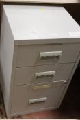 A THREE DRAWER METAL FILING CABINET