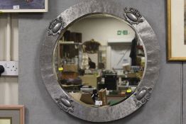 A MODERN SILVER FRAMED CIRCULAR BEVEL EDGED WALL MIRROR