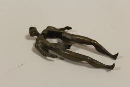 AN EIGHTEENTH CENTURY BRASS NUTCRACKER IN THE FORM OF A MALE NUDE
