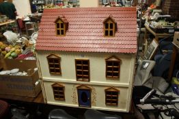 A VINTAGE WOODEN DOLLS HOUSE