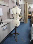 A DRESSMAKERS DUMMY ON STAND