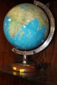 A MODERN ILLUMINATING DESK TOP GLOBE
