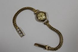 A LADIES 9CT GOLD CASED HELVETIA WRISTWATCH ON HALLMARKED 9 CARAT GOLD STRAP