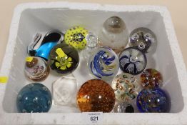 A BOX OF STUDIO GLASS PAPER WEIGHTS