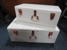 A MODERN WHITE METAL SET OF DECORATIVE TRUNKS - LARGEST W 60 cm