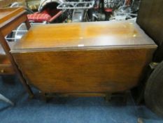 AN OAK BARLEYTWIST GATELEG DINING TABLE