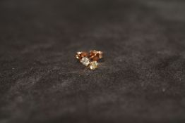 A PAIR OF 18ct ROSE GOLD FOUR CLAW SET RBC DIAMONDS STUDS, boxed. Diamonds 0.44ct