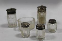 A BAG OF SILVER TOPPED PEPPERETTES AND CRUETS