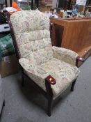 AN UPHOLSTERED ARMCHAIR