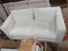 A MODERN WHITE TWO SEATER SETTEE