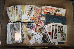 A SUITCASE OF CIGARETTE CARDS AND POSTCARDS ETC.
