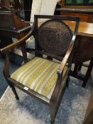 AN ANTIQUE BERGERE ARMCHAIR A/F