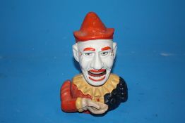 A MODERN CAST METAL JESTER MONEY BANK