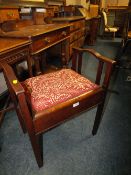 AN EDWARDIAN MAHOGANY PIANO STOOL