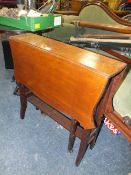 AN EDWARDIAN MAHOGANY SUTHERLAND TABLE
