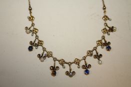 AN ANTIQUE YELLOW METAL SEA PEARL AND BLUE STONE NECKLACE
