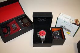 TWO BOXED WRISTWATCHES TOGETHER WITH AN LG PHONE HEADSET KIT AND ANOTHER